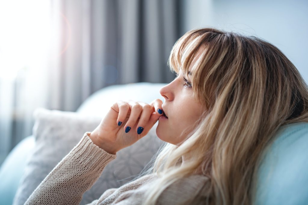 Woman at home deep in thoughts thinking and planning